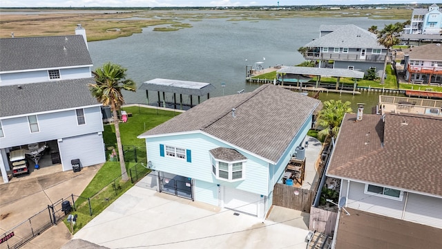 aerial view featuring a water view and a residential view