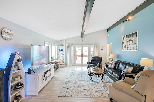 living room with light wood-style flooring, french doors, and vaulted ceiling with beams
