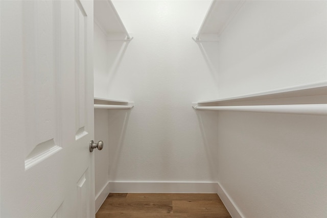 spacious closet with wood finished floors