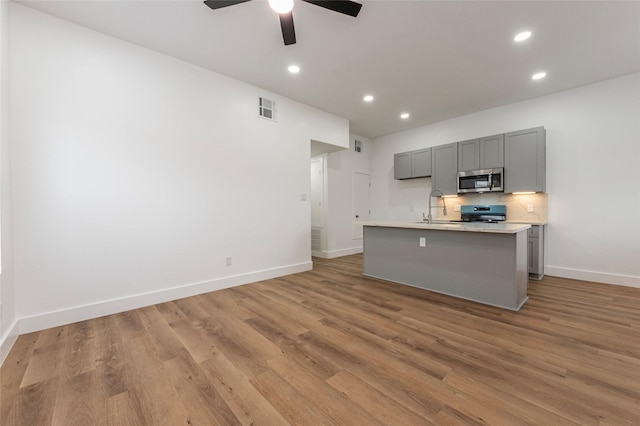kitchen with gray cabinets, visible vents, light countertops, appliances with stainless steel finishes, and recessed lighting