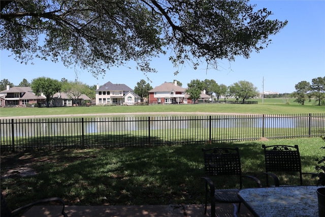 16210 Pinon Vista Dr, Houston, TX 77095 - view of yard featuring fence, a water view, and mail area