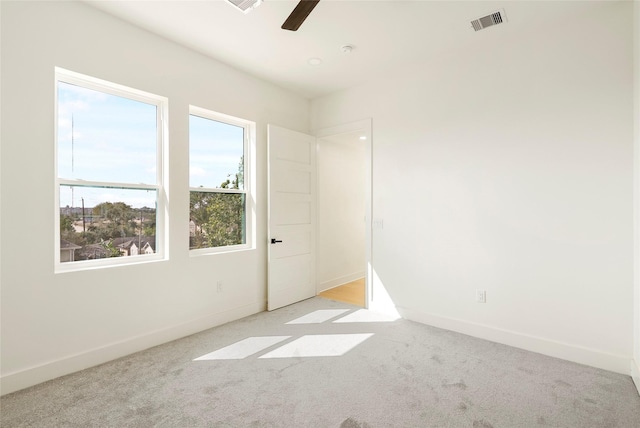 407 Grove St Unit B, Houston, TX 77020 - empty room with ceiling fan, light colored carpet, a smoke detector, and a water view