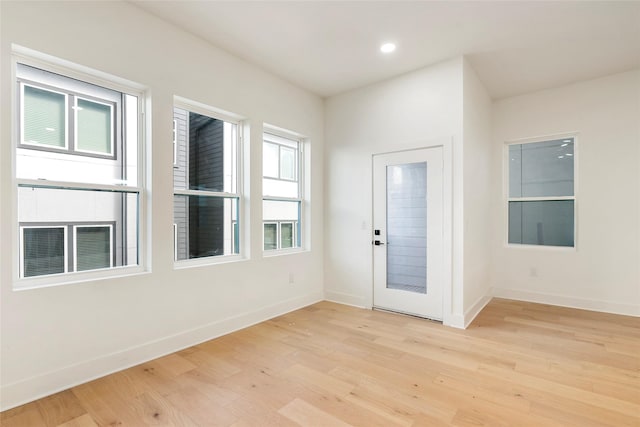 407 Grove St Unit B, Houston, TX 77020 - foyer with light wood-style flooring and recessed lighting