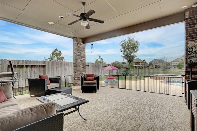 view of patio / terrace featuring a fenced backyard, a ceiling fan, and an outdoor hangout area