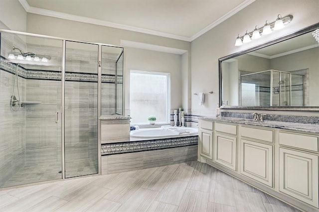 full bath with a shower stall, a bath, vanity, and ornamental molding