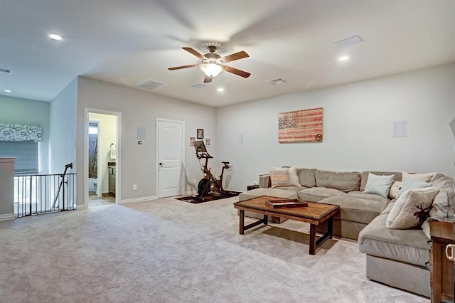 living area featuring a ceiling fan, recessed lighting, light colored carpet, and baseboards