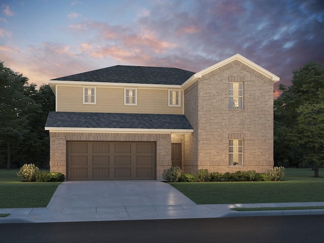 traditional home featuring concrete driveway, a yard, brick siding, and a garage