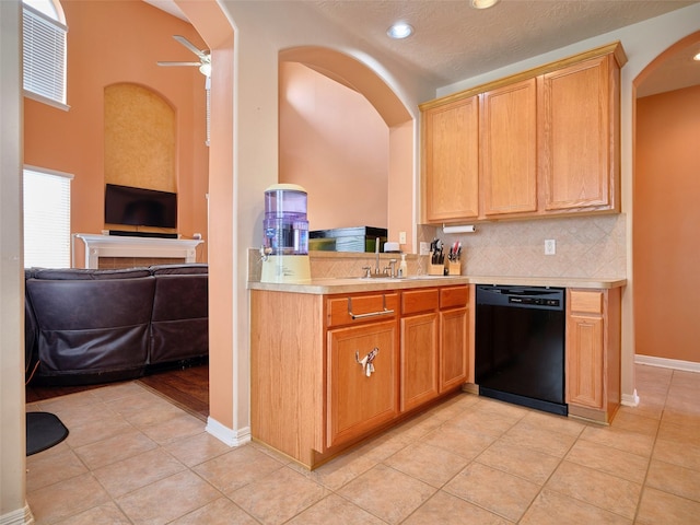 23623 Breckenridge Forest Dr, Spring, TX 77373 - kitchen with a ceiling fan, dishwasher, open floor plan, arched walkways, and light countertops