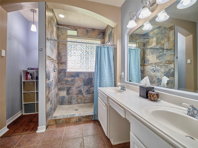23623 Breckenridge Forest Dr, Spring, TX 77373 - full bathroom featuring a sink, baseboards, and tiled shower