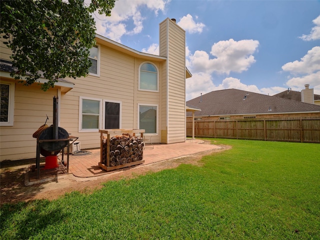 23623 Breckenridge Forest Dr, Spring, TX 77373 - back of property with a chimney, a lawn, a patio, fence private yard, and a fire pit