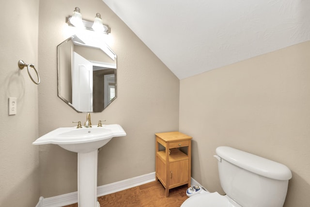 3818 Rose Grove Ln, Katy, TX 77494 - half bath featuring toilet, vaulted ceiling, wood finished floors, and baseboards