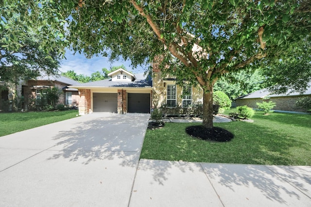 3818 Rose Grove Ln, Katy, TX 77494 - view of front facade featuring a garage, a front yard, driveway, and brick siding