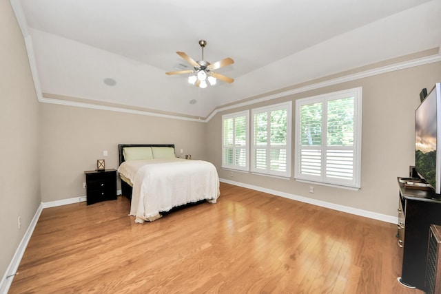 3818 Rose Grove Ln, Katy, TX 77494 - bedroom featuring multiple windows, light wood-style flooring, baseboards, ornamental molding, and lofted ceiling