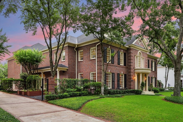 8722 Stable Crest Blvd, Houston, TX 77024 - view of front facade featuring brick siding and a front lawn