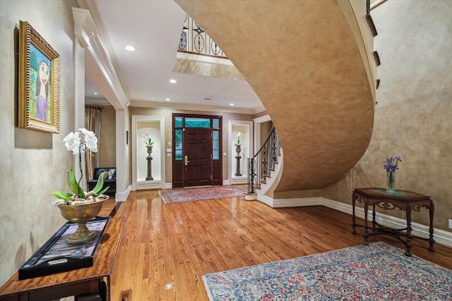 8722 Stable Crest Blvd, Houston, TX 77024 - foyer entrance with wood finished floors, crown molding, baseboards, recessed lighting, and stairs