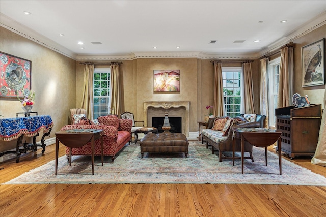 8722 Stable Crest Blvd, Houston, TX 77024 - living area with ornamental molding, wood finished floors, a fireplace, and recessed lighting