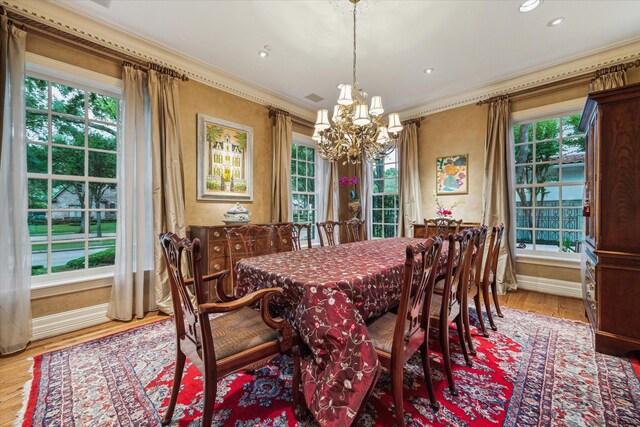 8722 Stable Crest Blvd, Houston, TX 77024 - dining area with a chandelier, ornamental molding, light wood-style floors, baseboards, and recessed lighting