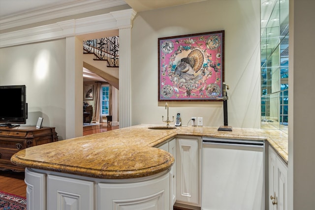 8722 Stable Crest Blvd, Houston, TX 77024 - kitchen featuring stainless steel dishwasher, a sink, white cabinets, and crown molding