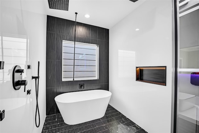 604 W 28th St Unit A, Houston, TX 77008 - full bath featuring tile patterned floors, a freestanding bath, tile walls, and walk in shower