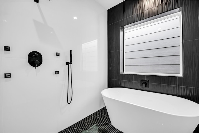 604 W 28th St Unit A, Houston, TX 77008 - bathroom featuring a soaking tub, tiled shower, and tile patterned floors