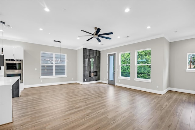 604 W 28th St Unit A, Houston, TX 77008 - unfurnished living room with baseboards, ceiling fan, visible vents, and crown molding