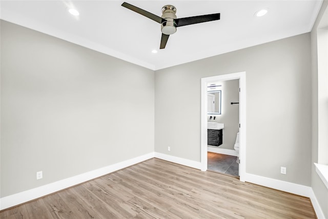 604 W 28th St Unit A, Houston, TX 77008 - unfurnished bedroom featuring baseboards, light wood-style flooring, and recessed lighting