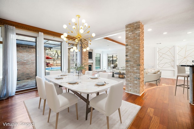 12414 Laneview Dr, Houston, TX 77070 - dining area with wood-type flooring, plenty of natural light, and ornate columns