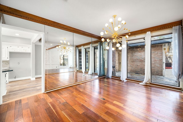 12414 Laneview Dr, Houston, TX 77070 - unfurnished dining area with baseboards, a notable chandelier, and light wood-style floors