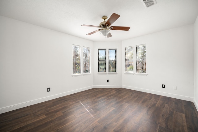 12414 Laneview Dr, Houston, TX 77070 - empty room featuring baseboards, dark wood finished floors, visible vents, and a ceiling fan