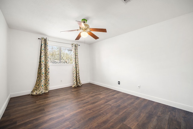 12414 Laneview Dr, Houston, TX 77070 - empty room featuring baseboards, dark wood-type flooring, and a ceiling fan