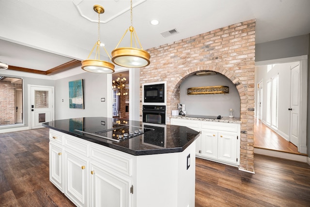 12414 Laneview Dr, Houston, TX 77070 - kitchen with a kitchen island, dark wood-style flooring, visible vents, and black appliances