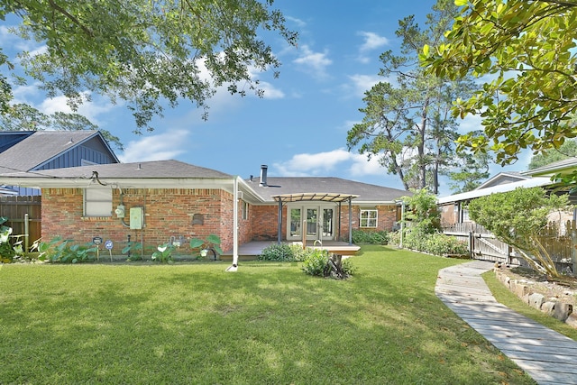 rear view of house with a pergola, brick siding, a patio, and french doors