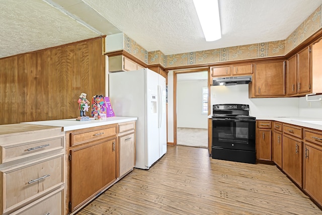 kitchen featuring black electric range oven, under cabinet range hood, white fridge with ice dispenser, a textured ceiling, and light wood-style floors