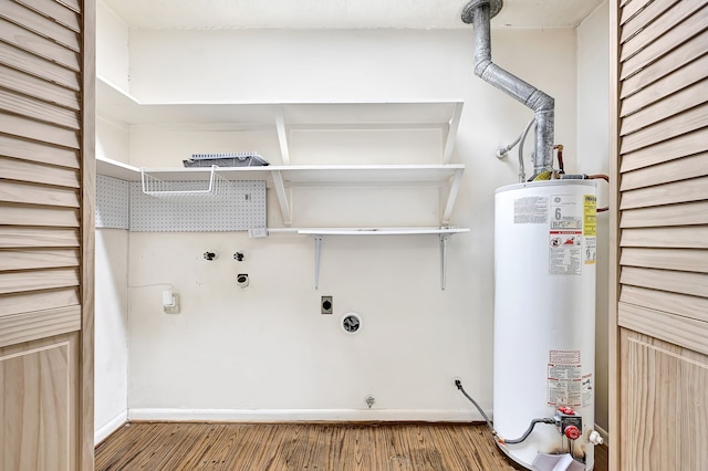 washroom with water heater, wood finished floors, baseboards, electric dryer hookup, and hookup for a washing machine