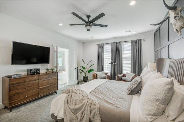bedroom featuring light colored carpet, recessed lighting, connected bathroom, a ceiling fan, and baseboards