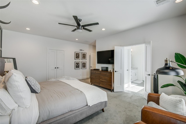 bedroom featuring light colored carpet, recessed lighting, ceiling fan, and ensuite bathroom