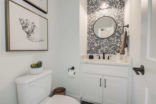 bathroom with toilet and vanity