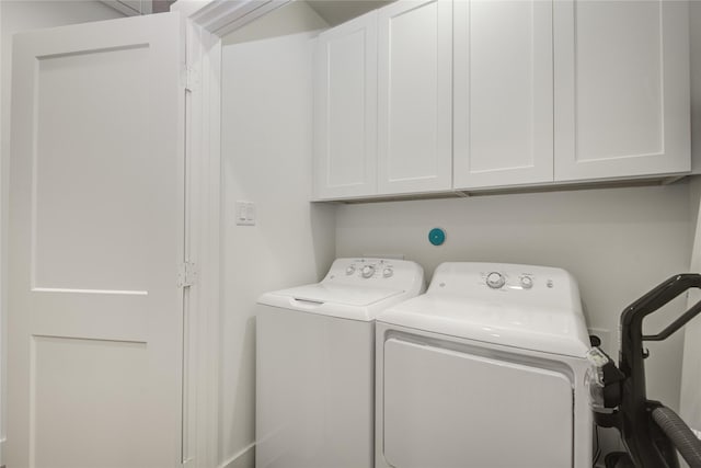 laundry room featuring cabinet space and washer and dryer