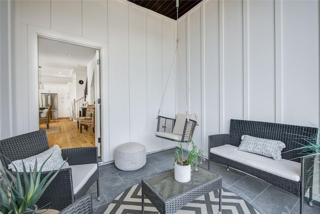 lobby featuring a decorative wall and stairs