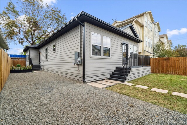 exterior space with a lawn and a fenced backyard