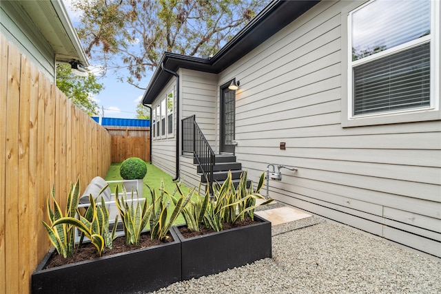 view of property exterior featuring fence