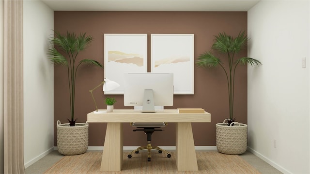 carpeted home office with baseboards
