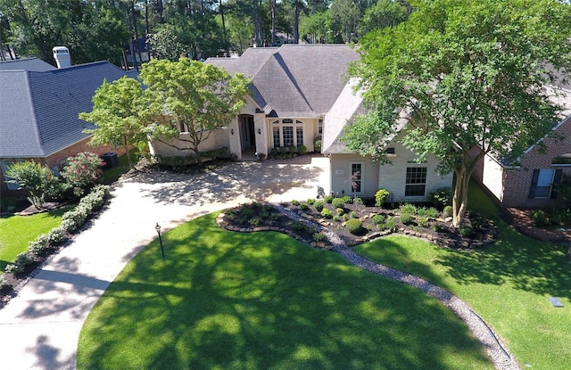 108 W Pines Dr, Montgomery, TX 77356 - view of front facade featuring a front lawn and driveway