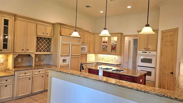 108 W Pines Dr, Montgomery, TX 77356 - kitchen with white appliances, crown molding, light tile patterned floors, decorative backsplash, and a kitchen island