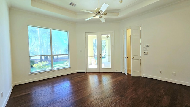 108 W Pines Dr, Montgomery, TX 77356 - empty room featuring french doors, a raised ceiling, ornamental molding, a ceiling fan, and dark wood finished floors