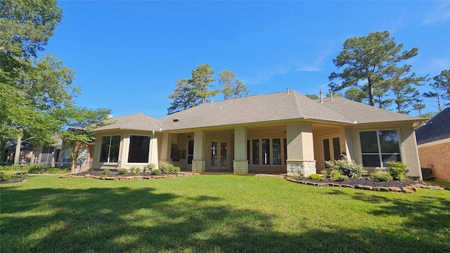 108 W Pines Dr, Montgomery, TX 77356 - rear view of property featuring french doors, a yard, and stucco siding