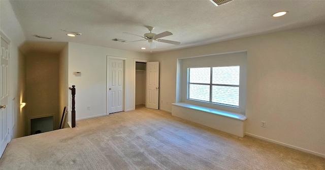 108 W Pines Dr, Montgomery, TX 77356 - unfurnished bedroom featuring light carpet, recessed lighting, baseboards, ceiling fan, and a textured ceiling