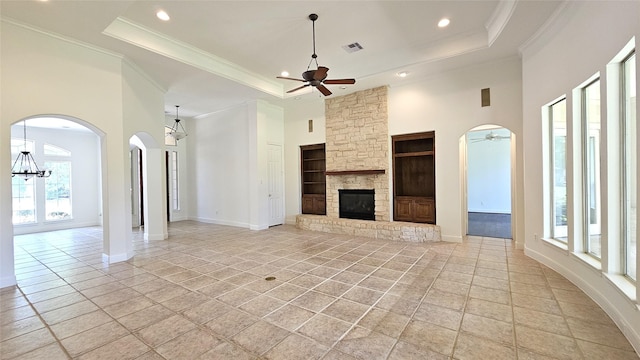 108 W Pines Dr, Montgomery, TX 77356 - unfurnished living room featuring a ceiling fan, plenty of natural light, a tray ceiling, recessed lighting, and a high ceiling
