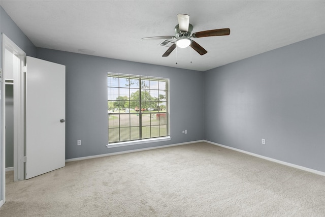 4517 Coachman Dr, Baytown, TX 77521 - unfurnished room featuring visible vents, baseboards, ceiling fan, and carpet floors