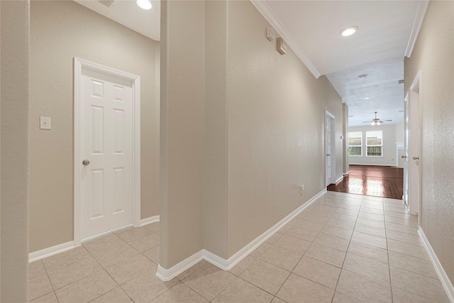 7431 Pony Crk, Missouri City, TX 77459 - corridor with light tile patterned floors, baseboards, a textured wall, recessed lighting, and ornamental molding